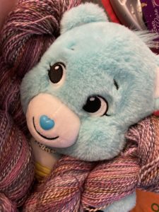 TdF yarn skeins get a care bear hug